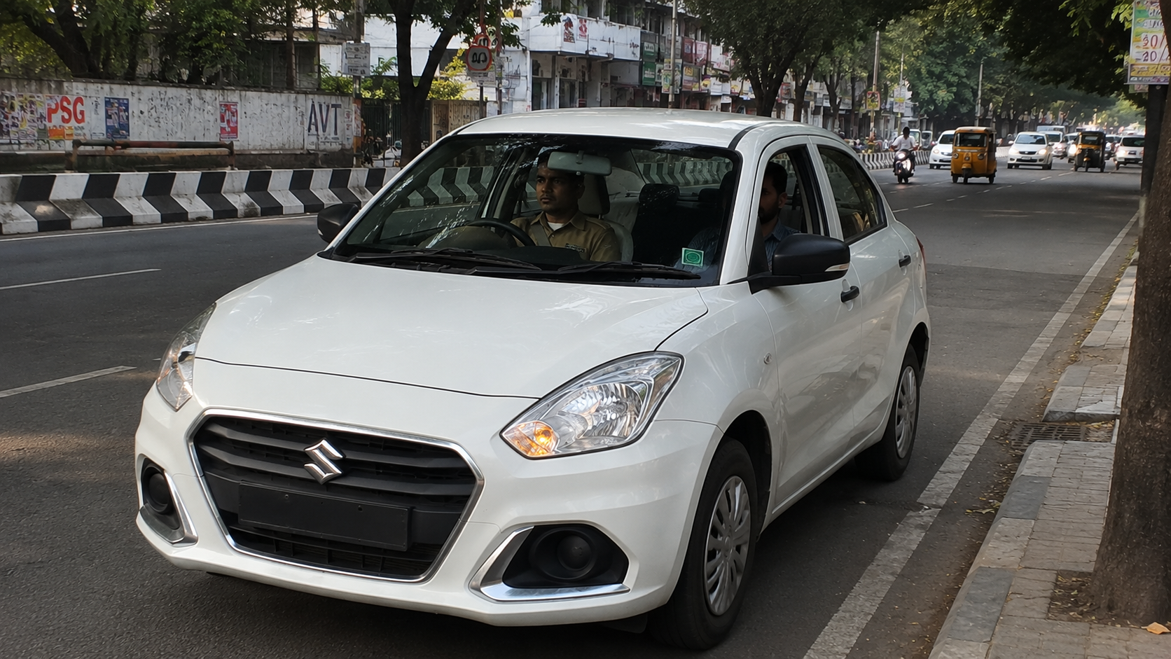 Experienced Indian taxi driver standing beside his cab